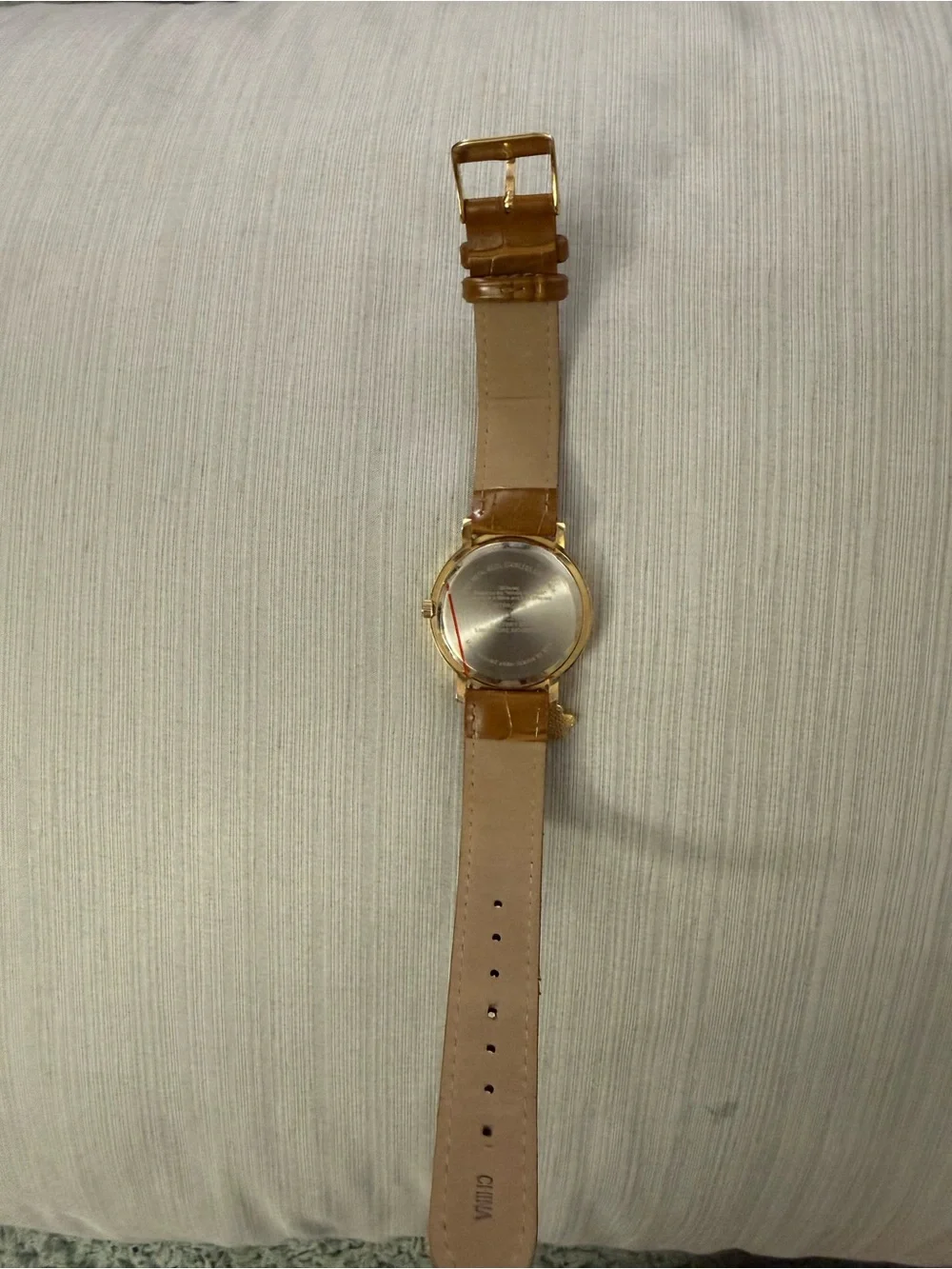 Disney Winnie the Pooh watch features a crystal-bezel dial and dangling charms o